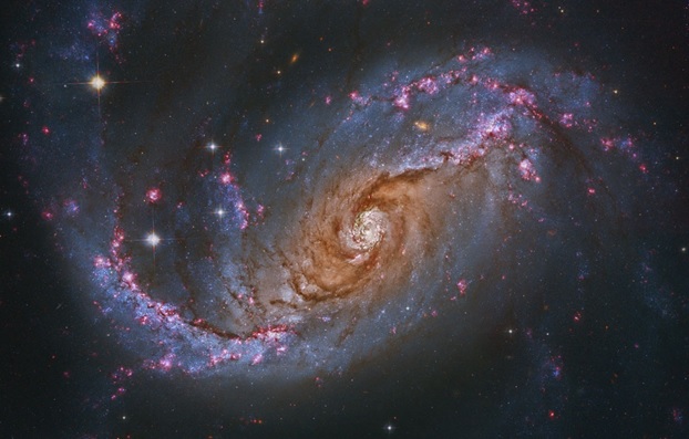 تصویری از یک کهکشان مارپیچی میله ای